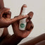Applying facial serum for oily and blemish prone skin, showing the silky liquid texture ideal for balancing skin