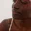 Hydrating texture of hyaluronic acid mist spritzed on face