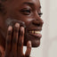 Applying Moisture Rich Face Cream to face, showing it quickly absorbing into dry skin to deeply hydrate